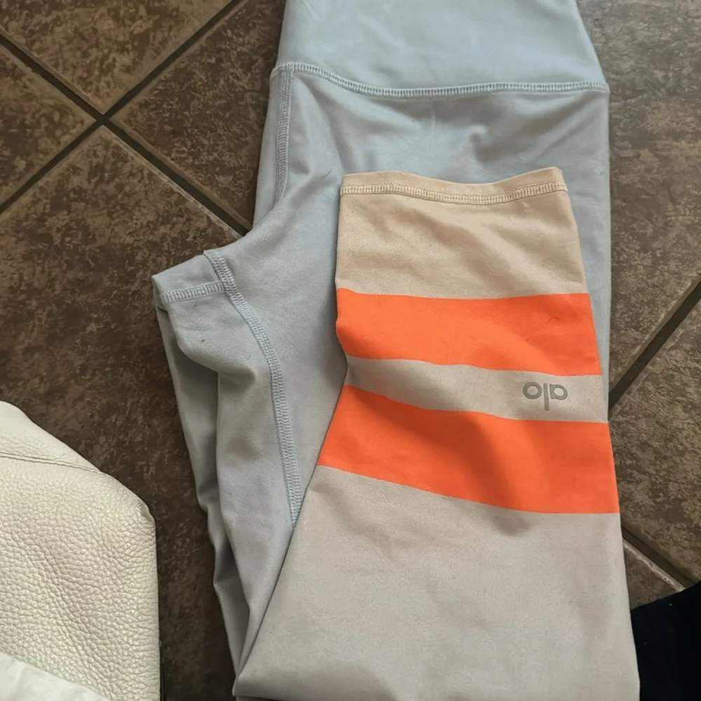 ALO Yoga Women's Leggings in Light Blue with Orange Stripes